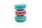 Three delicious red and green colored macaroons isolated