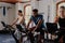 Three determined young multiracial adults doing cardio on exercise bike at the gym