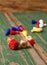 Three dices and color figurines on old wooden board