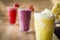 Three different Fruit shakes, watermelon,pinapple and mixed berry