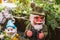 Three different garden gnomes representing different moments