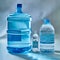 Three different sized bottles of fresh water