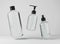 Three different transparent glass bottles for hair and body care products 3D render, set of floating cosmetic containers