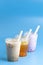 Three Different Types of Boba Tea on a Bright Blue Background