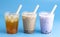 Three Different Types of Boba Tea on a Bright Blue Background