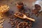 three different varieties of fresh roasted coffee beans in woden bowls