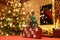 Three-dimensional Advent Calendar with stylised Christmas Tree in the middle of Christmassy illuminated Family Room