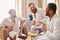 Three diverse, cheerful men in bathrobes