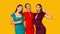 Three Diverse Girlfriends Gesturing Victory Sign Posing On Yellow Background