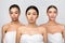 Three Diverse Girls Wrapped In Bath Towels Standing In Studio