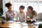 Three diverse student girls studying do college research project together