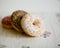 Three donuts on a background in the style of a shabby chic.