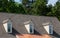 Three Dormers over Asphalt and Copper