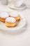 Three doughnuts on white plate