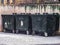 Three dust trash bin in winter snow