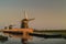 Three Dutch historic windmills in a row