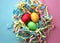 Three dyed Easter eggs in a colorful nest on mixed pink and blue background. Top view