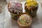 Three Easter cakes on a white napkin background.