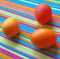 Three easter eggs on the striped fabric