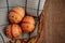 Three Easter ornamented eggs in a basket