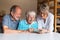 Three elderly persons using smart phone