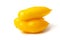 Three elongated yellow tomatoes lie on a white background