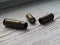 Three empty bullet cartridge on the wood background