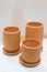 Three empty clay cups