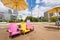 Three empty colourful chairs on Toronto Beach