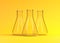 Three empty erlenmeyer flask on yellow background