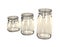 Three empty preserving jars.