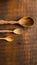 Three empty wooden spoons of different sizes