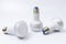 Three energy saving lamp with e27 sockets on white background