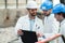 Three engineer men with safety helmet teamwork