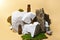 Three essential oil bottles on stone, moss, wood on beige background. Beauty set, organic medical treatment