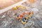 Three excavators on caterpillars in the foundation pit during the construction of the building foundation, digging. Aerial top