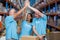 Three excited volunteers giving high five