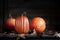 Three Fall Pumpkins with Fall Leaves