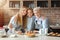 Three family generations having breakfast together at home