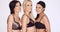 Three fashion models in black bras