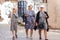 Three fashionable cheerful old ladies walk through the old town - Antalya, Turkey, 04.23.2019