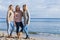 Three fashionable sister on the beach