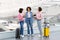 Three Female Friends Arguing While Waiting At Airport Terminal