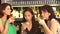 Three Female Friends Enjoying Drink In Cocktail Bar