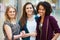 Three Female Friends Shopping In Mall Together