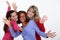 Three female friends waving