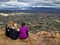 Three female hikers on mountain summit with city view, Camelback Mountain, Phoenix, Arizona, USA