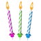 Three festive burning colored candles isolated