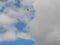 Three fighter planes under the clouds.