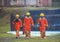 Three firefighters in uniform walking forward